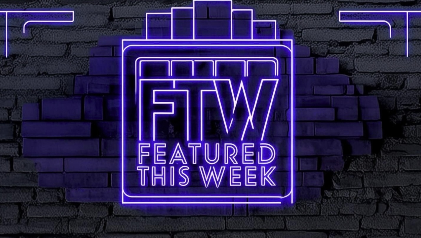 FTW, Featured This Week, purple neon logo against a brick wall